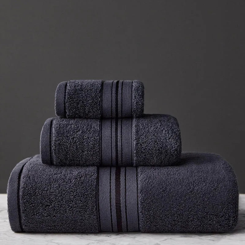 Three-piece cotton bath towel set in floral colours showing bath towel, hand towel and face cloth with optional logo printing