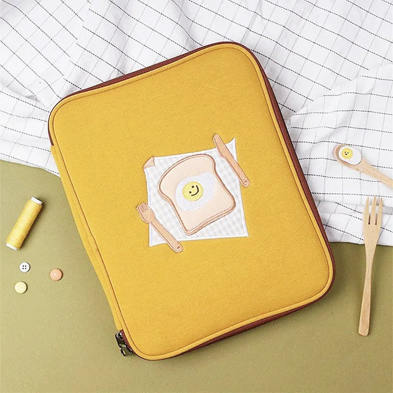 Yellow polyester laptop liner bag with embroidered toast design for 11-inch and 13-inch devices