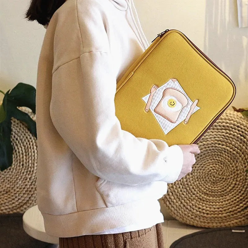 Yellow polyester laptop liner bag with embroidered toast design for 11-inch and 13-inch devices