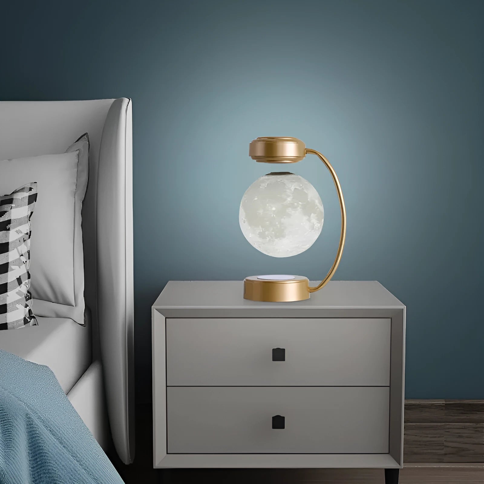 Magnetic levitation moon lamp floating above base with touch control and colour-changing illumination