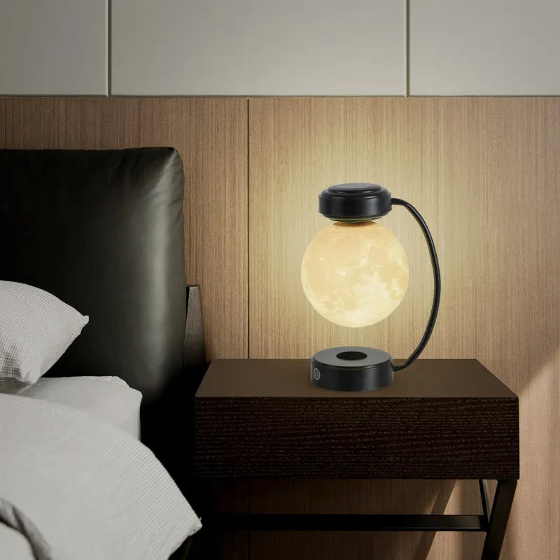 Magnetic levitation moon lamp floating above base with touch control and colour-changing illumination