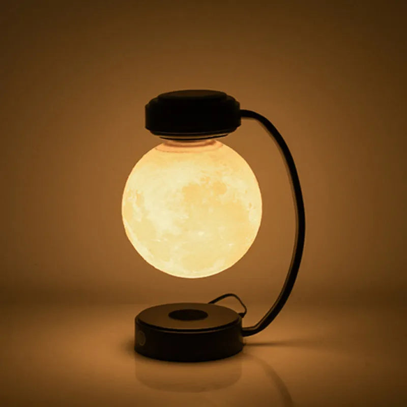 Magnetic levitation moon lamp floating above base with touch control and colour-changing illumination