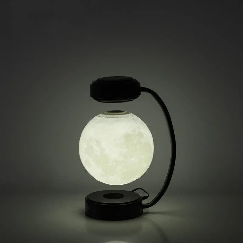 Magnetic levitation moon lamp floating above base with touch control and colour-changing illumination