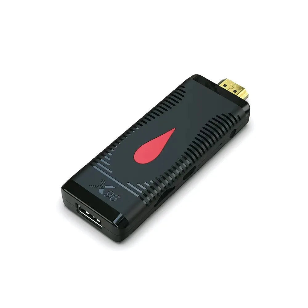 Smart Android TV set-top box dongle with remote control and HDMI cable on a white background.