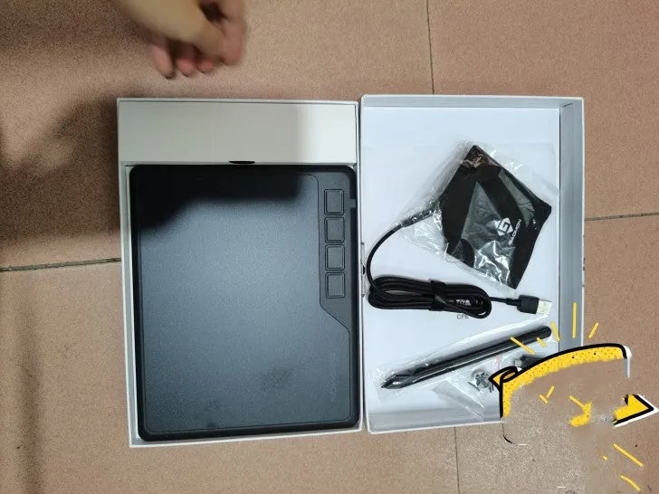 Gaoman S620 black digital drawing board with USB cable and stylus pen on desk