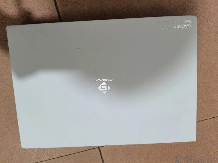 Gaoman S620 black digital drawing board with USB cable and stylus pen on desk