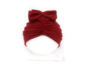 Soft acrylic knitted baby hat in a solid colour, shown on a mannequin head, suitable for newborns and infants.