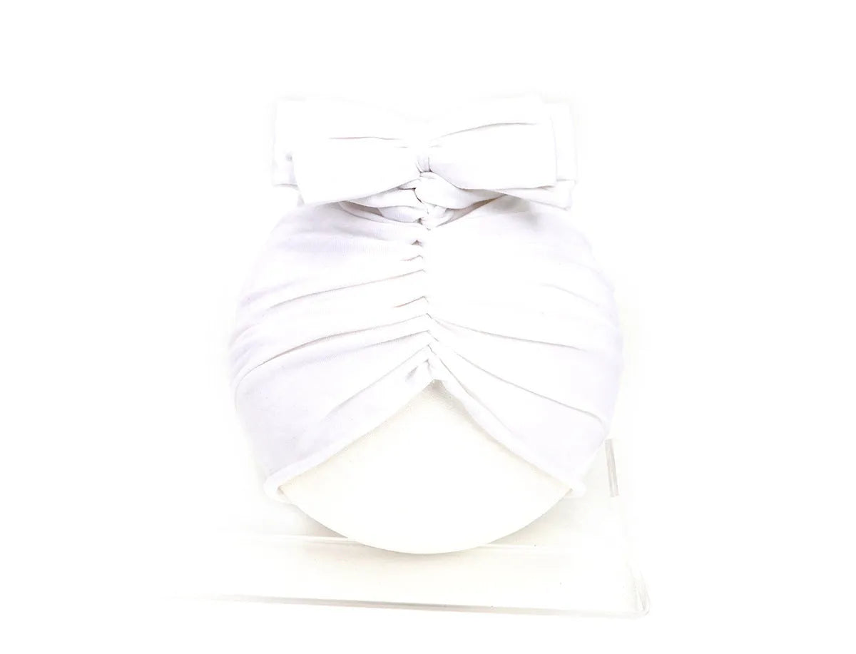 Soft acrylic knitted baby hat in a solid colour, shown on a mannequin head, suitable for newborns and infants.