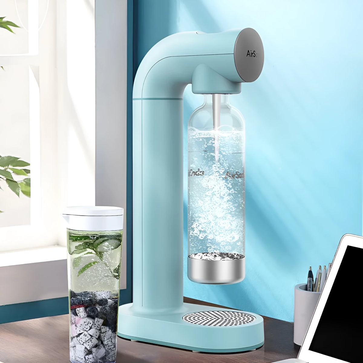 Airsoda bubble water machine in black with 1L bottle and push-button control