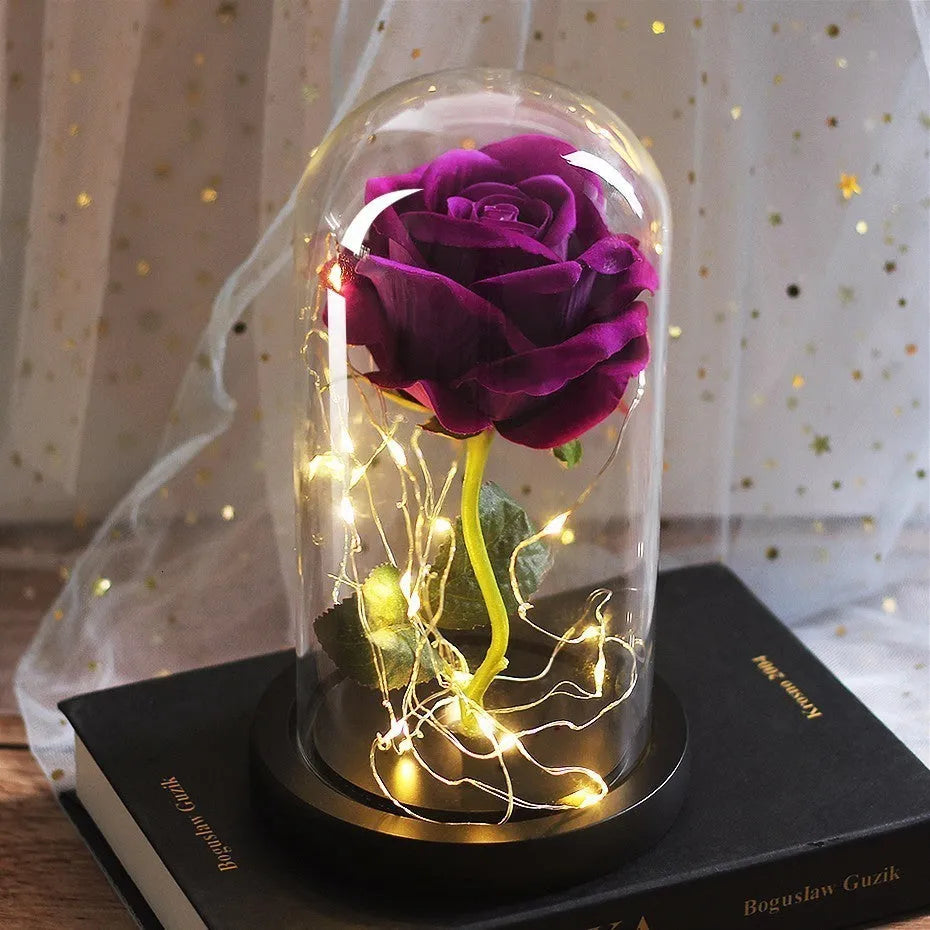 Artificial silk rose LED ornament with glass lampshade showing warm white lights, available in multiple colours.
