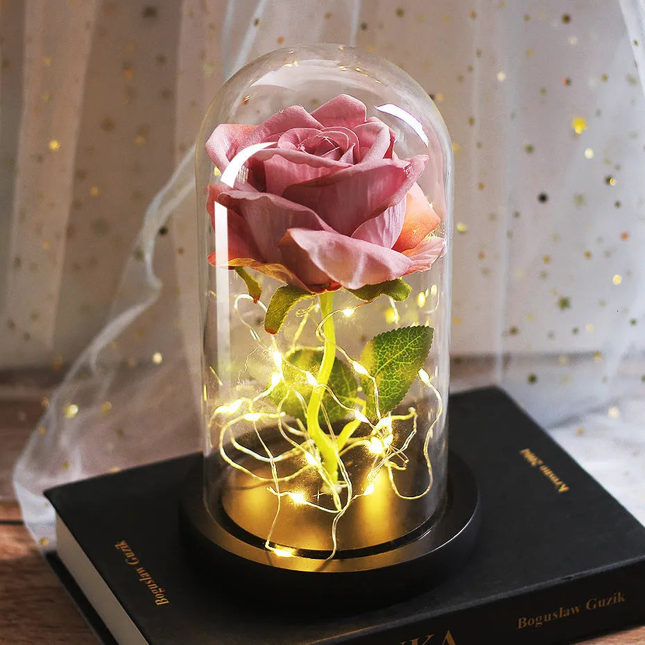 Artificial silk rose LED ornament with glass lampshade showing warm white lights, available in multiple colours.