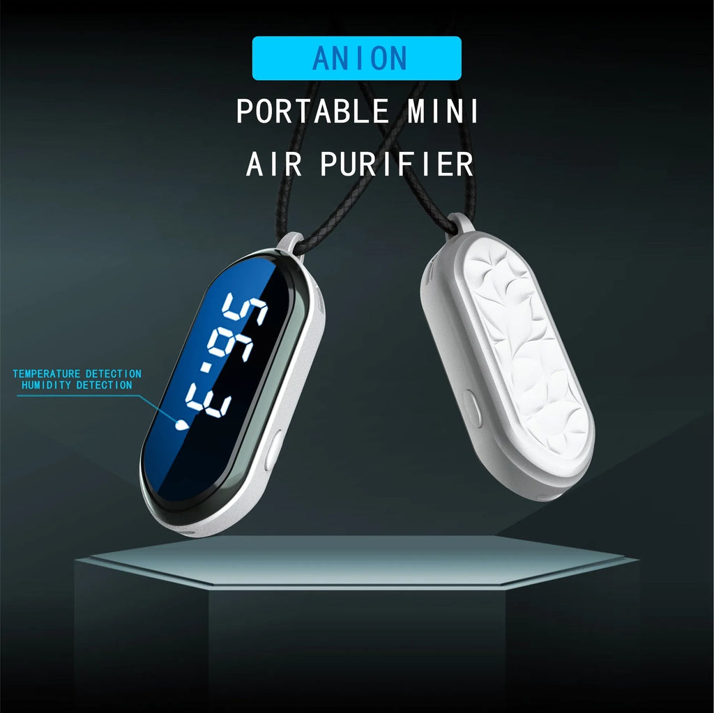 Portable negative ion air purifier in pearl white with metal lanyard and USB cable on a desk