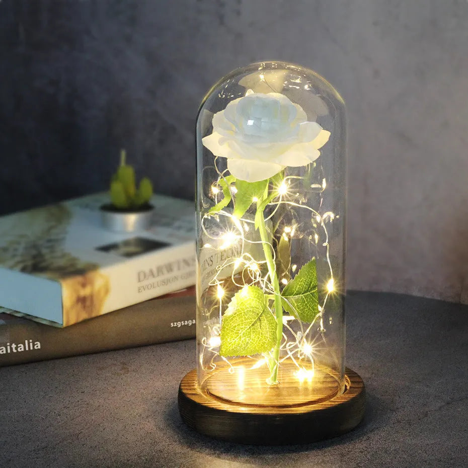 Artificial silk rose LED ornament with glass lampshade showing warm white lights, available in multiple colours.