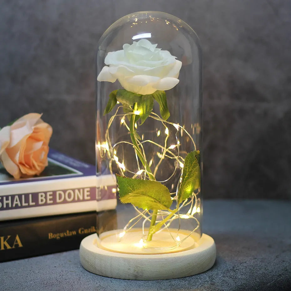 Artificial silk rose LED ornament with glass lampshade showing warm white lights, available in multiple colours.