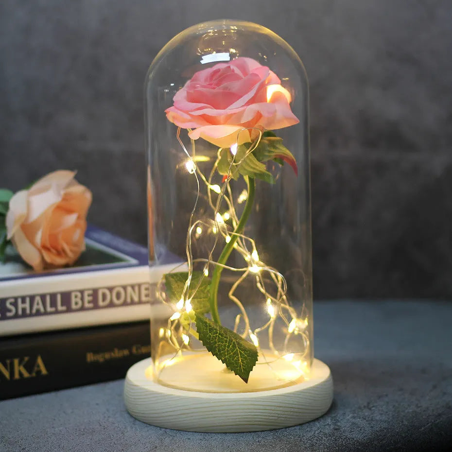 Artificial silk rose LED ornament with glass lampshade showing warm white lights, available in multiple colours.