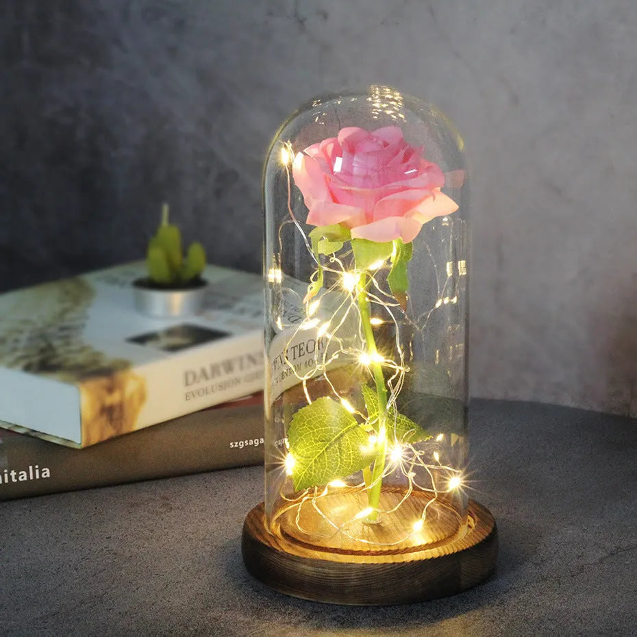 Artificial silk rose LED ornament with glass lampshade showing warm white lights, available in multiple colours.