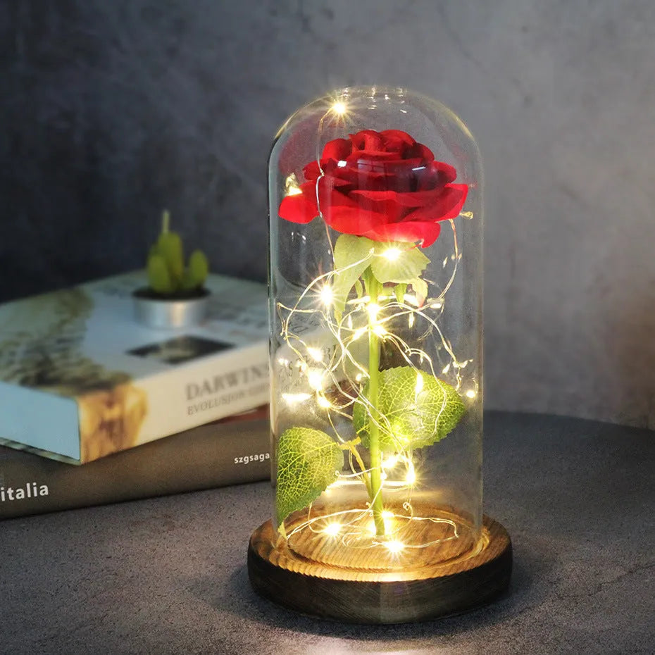 Artificial silk rose LED ornament with glass lampshade showing warm white lights, available in multiple colours.