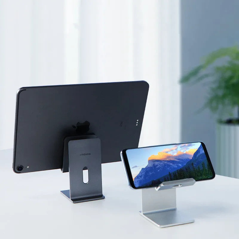 Alloy mobile phone desktop holder in dark grey or silver for universal phone and tablet support.