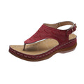 Women's solid colour wedge heel flip flop sandals with an adjustable buckle strap.