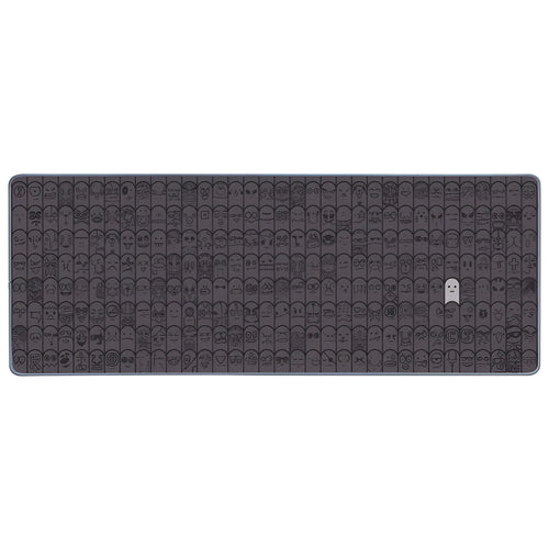 Grey cloth mousepad with wrist support sticker on a wooden desk