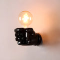 Creative fist-shaped resin wall lamp for bar, restaurant or corridor background decoration in black colour