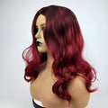 Burgundy long curly wig with big wavy gradient colour and centre bangs on a mannequin