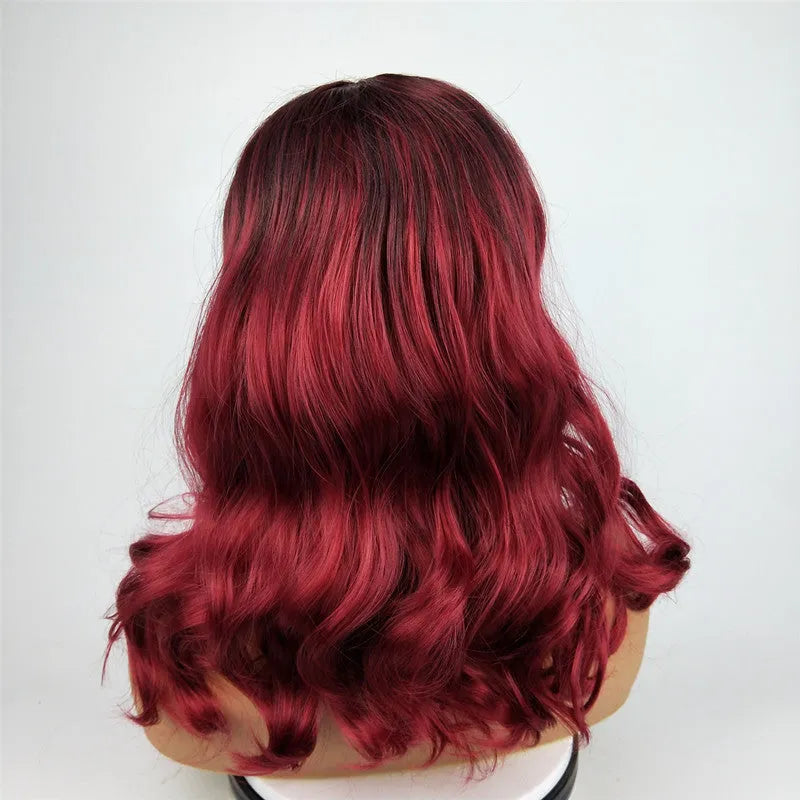 Burgundy long curly wig with big wavy gradient colour and centre bangs on a mannequin