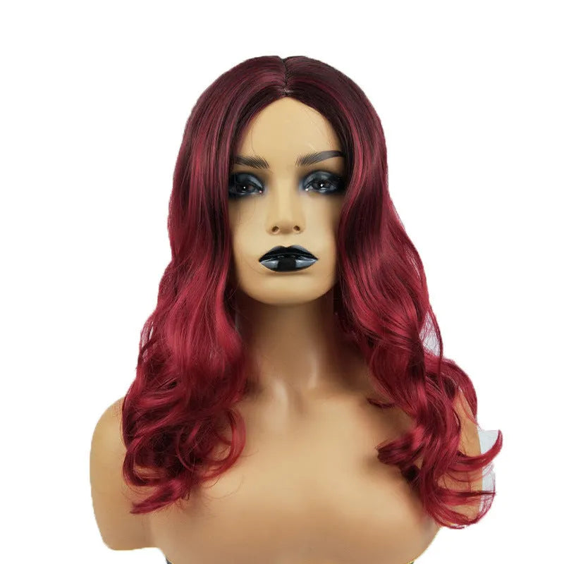 Burgundy long curly wig with big wavy gradient colour and centre bangs on a mannequin