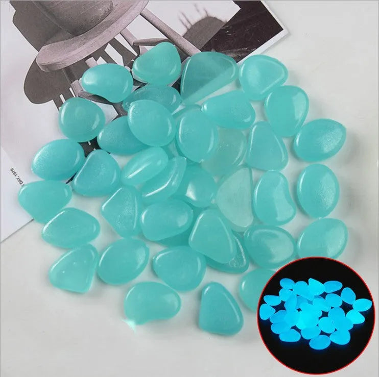 Luminous fluorescent aquarium and garden pebbles in mixed colours including dark purple, yellow, light blue, pink, orange