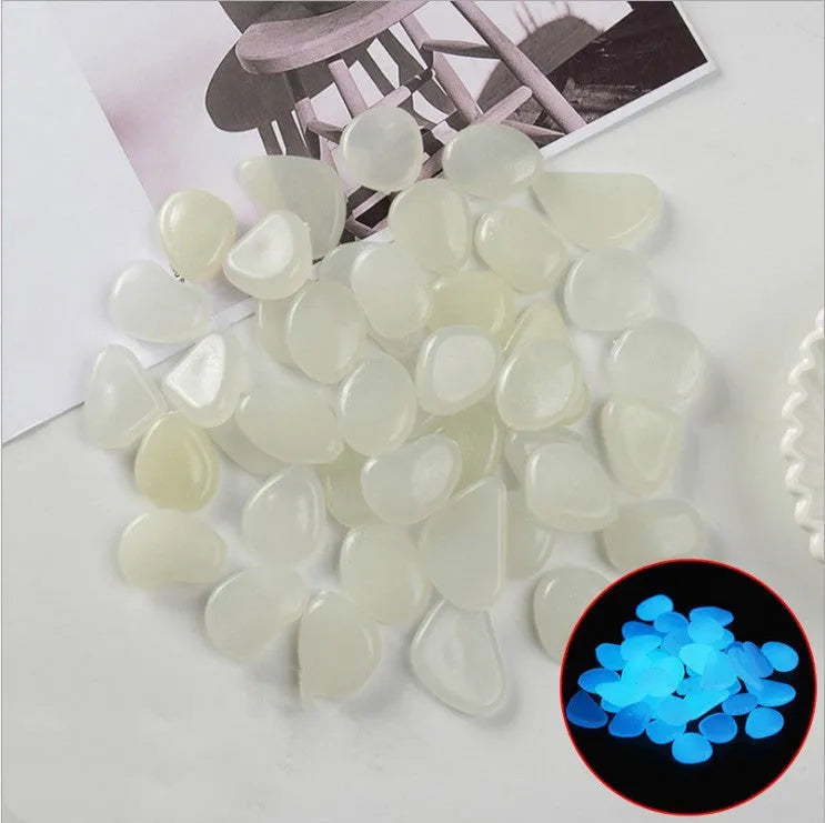 Luminous fluorescent aquarium and garden pebbles in mixed colours including dark purple, yellow, light blue, pink, orange