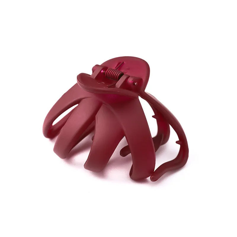Children's plastic hair clip in small size available in green, dark blue, wine red, black, dark pink, and blue gray.