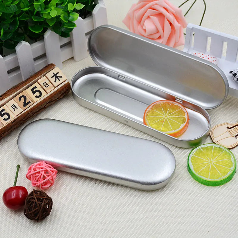 Rectangular frosted tinplate metal box for pen and cosmetic storage.
