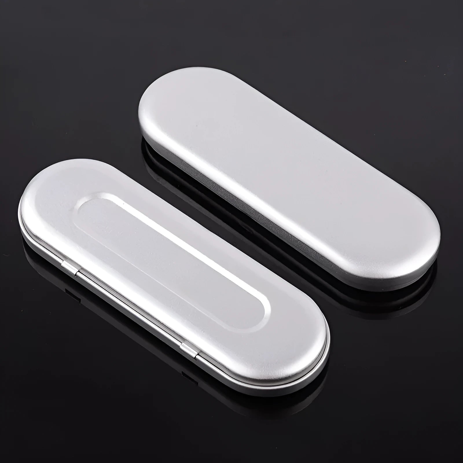 Rectangular frosted tinplate metal box for pen and cosmetic storage.