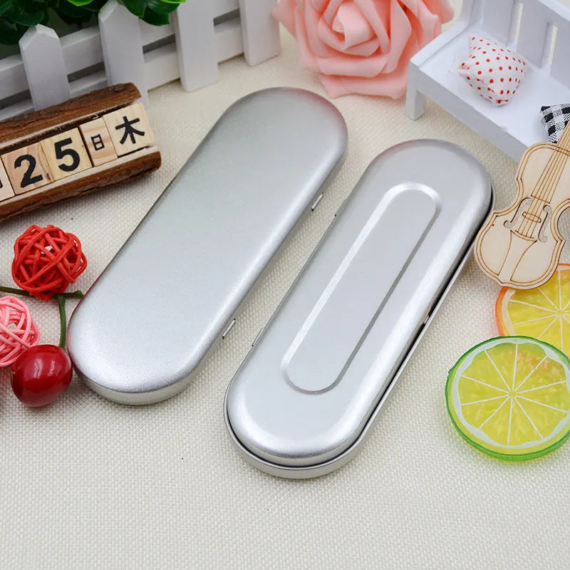 Rectangular frosted tinplate metal box for pen and cosmetic storage.