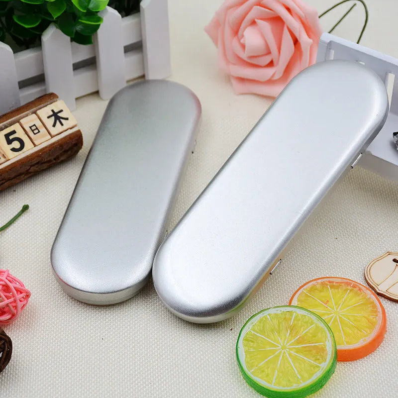 Rectangular frosted tinplate metal box for pen and cosmetic storage.
