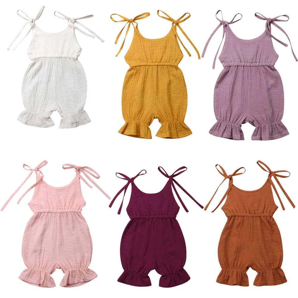 Baby girls sleeveless solid cotton romper jumpsuit in pink, front view