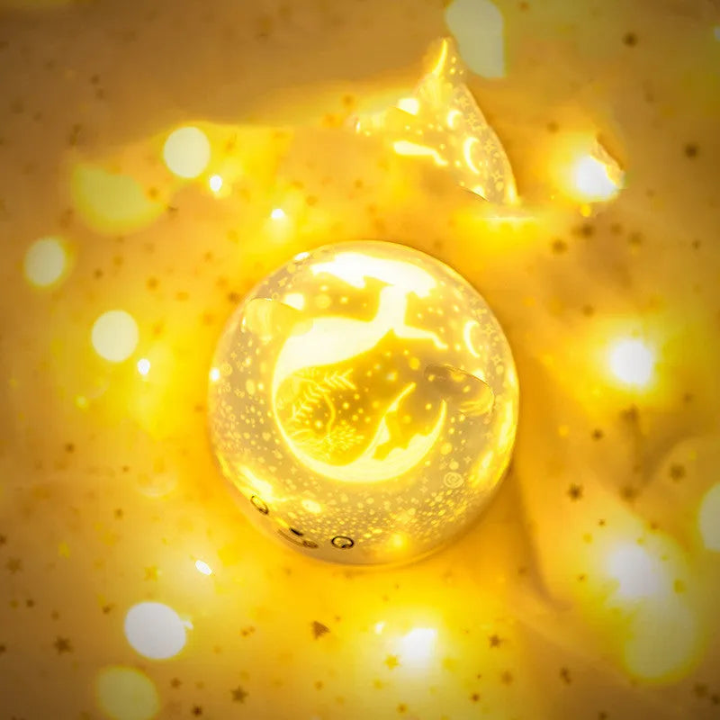 Rotatable star projector night light with astronaut bear slide projection and USB charging cable