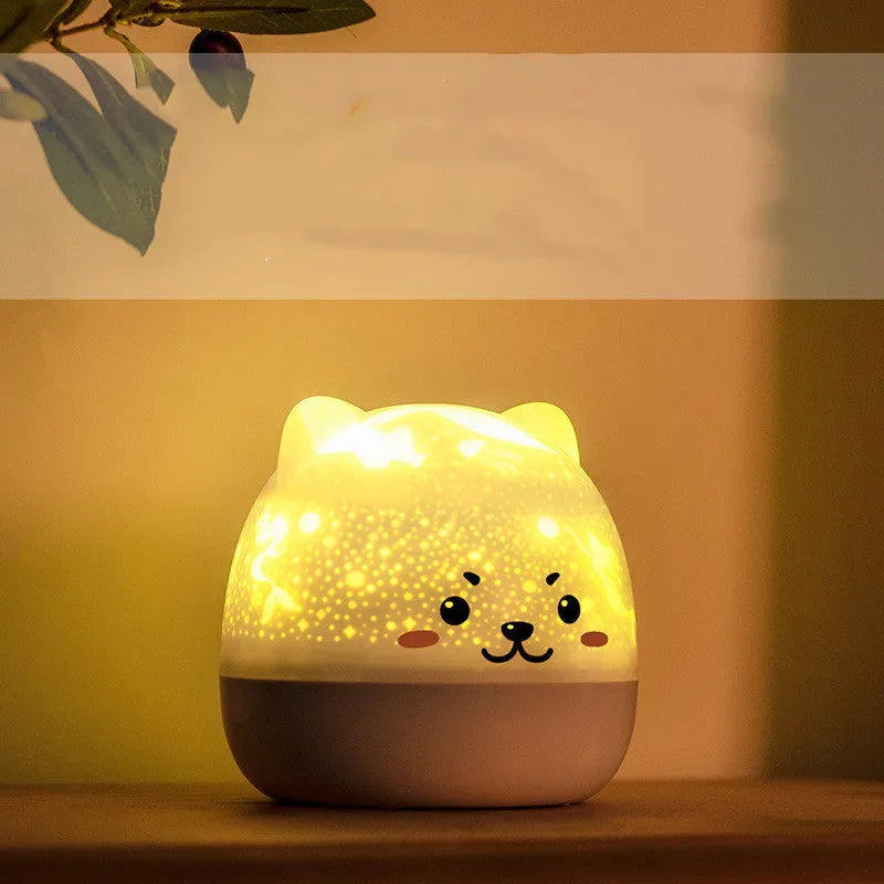 Rotatable star projector night light with astronaut bear slide projection and USB charging cable