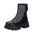Women's black PU Roman sandals with rear zipper and round toe on a light background, side view.