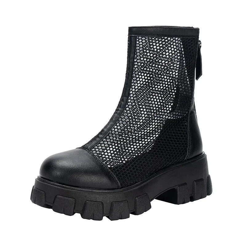 Women's black PU Roman sandals with rear zipper and round toe on a light background, side view.