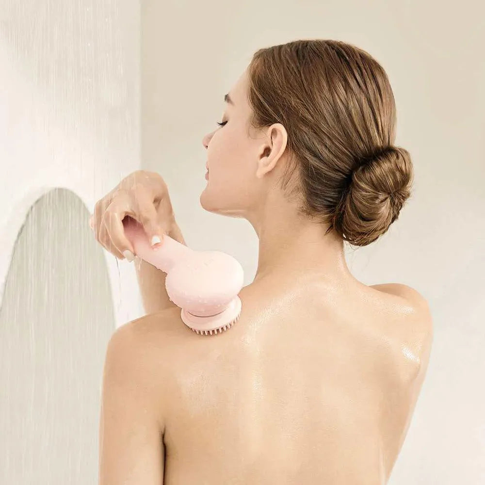 Grey and pink electric shower brush with rotating massage heads