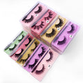One pair of natural 3D imitation mink false eyelashes in elongated eye tail style with a brush on a white background