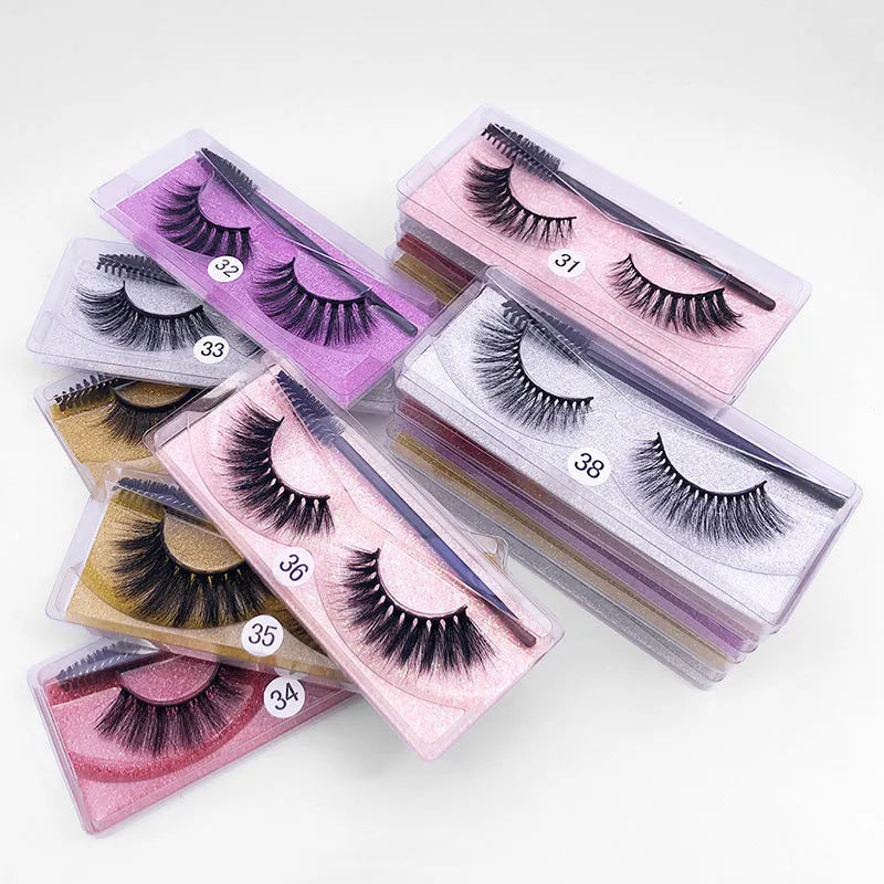 One pair of natural 3D imitation mink false eyelashes in elongated eye tail style with a brush on a white background