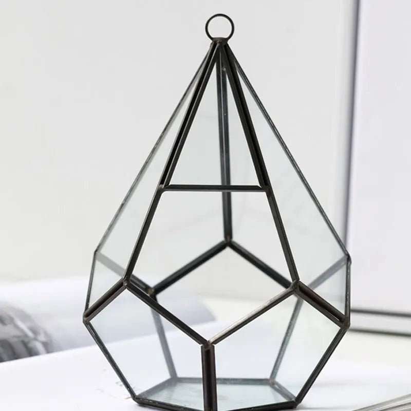 Square metal-framed glass succulent planter in two size options for home decoration.