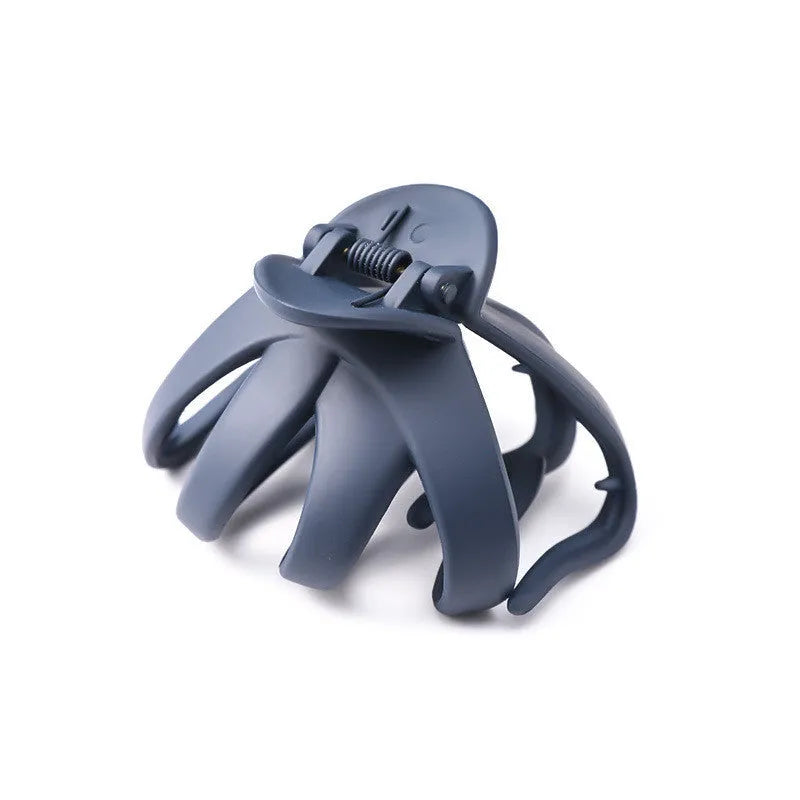Children's plastic hair clip in small size available in green, dark blue, wine red, black, dark pink, and blue gray.