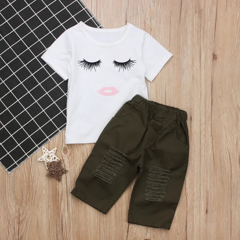 Pudcoco white two-piece girl set with eyelash short-sleeve top and ripped trousers on child model