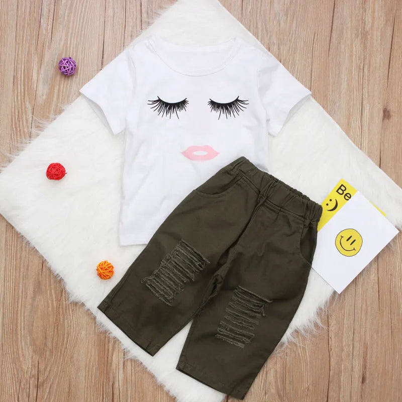 Pudcoco white two-piece girl set with eyelash short-sleeve top and ripped trousers on child model