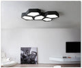 Geometric shaped iron frame LED wall light with remote control in black or white colour