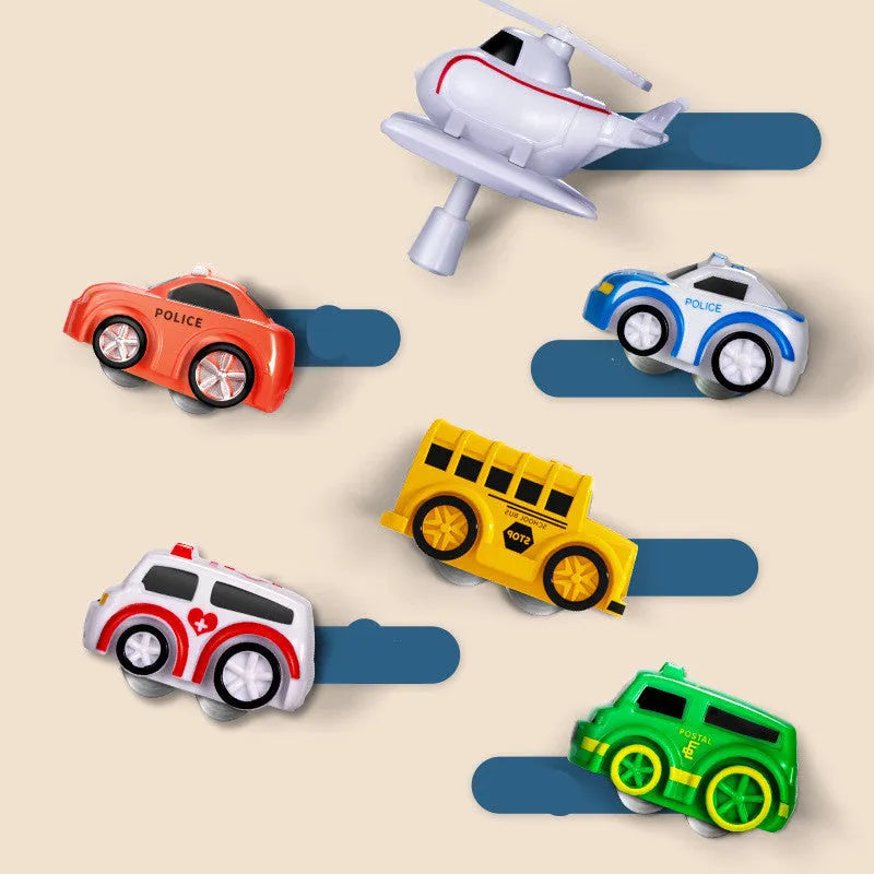 Children's interactive parking lot toy track with crane, conveyor stairs, and assorted toy vehicles.