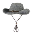 Unisex papyrus wide brim sun hat with adjustable wind lanyard in grey, shown on a beach background
